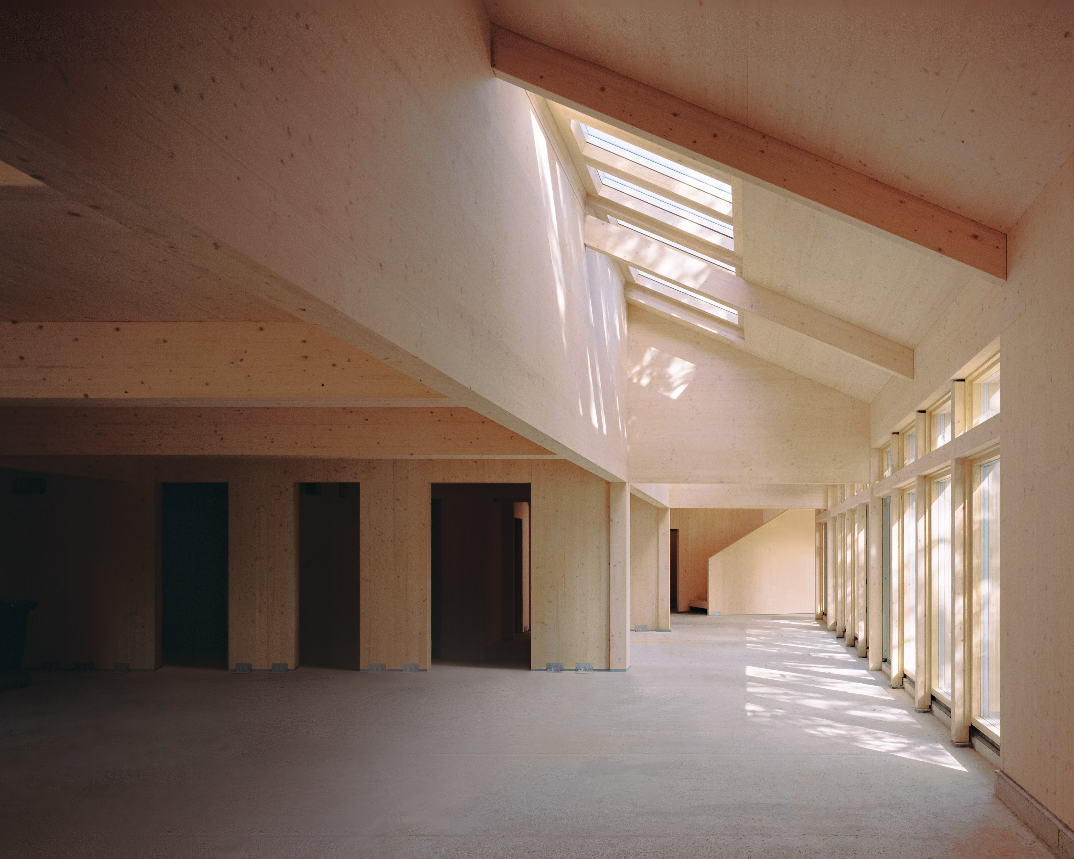 The Space — main hall with raking light through clerestory windows